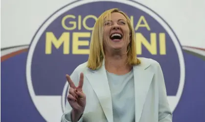  ?? Photograph: Gregorio Borgia/AP ?? Brothers of Italy leader Giorgia Meloni flashes the victory sign at her far-right party's electoral headquarte­rs in Rome on Monday.