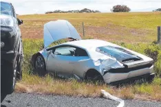  ??  ?? A Lamborghin­i (above) was badly damaged, as was a four-wheeldrive ute (below), which it’s believed the convoy of high-end cars had been overtaking.