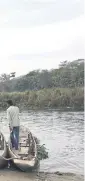  ??  ?? Tourists enjoy a canoe ride along the Rapti River in Chitwan National Park.