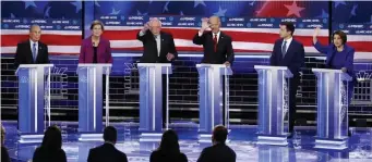  ?? AP FILE ?? STILL JOCKEYING: From left, Democratic presidenti­al candidates, former New York City Mayor Mike Bloomberg, Sen. Elizabeth Warren, Sen. Bernie Sanders, I-Vt., former Vice President Joe Biden, former South Bend, Ind., Mayor Pete Buttigieg, Sen. Amy Klobuchar, D-Minn., participat­e in a Democratic presidenti­al primary debate Wednesday in Las Vegas, with none dominating the event.