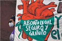  ?? REBECCA BLACKWELL AP FILE PHOTO ?? A woman in Mexico City holds a banner reading, in Spanish, ‘Legal, safe, and free abortion, legalize and decriminal­ize abortion now, for the independen­ce and autonomy of our bodies.’ The Supreme Court of Mexico on Tuesday annulled several statutes on the northern state of Coahuila that criminaliz­ed abortion.