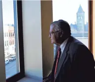  ?? EAGLE-GAZETTE BARRETT LAWLIS/LANCASTER ?? David Landefeld gazes out from the Columbia Building onto Lancaster’s downtown. He’s retiring after serving one term as a Fairfield County Municipal Court judge.