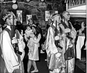  ?? BRYAN ANSELM/FOR THE WASHINGTON POST ?? Church attendants hold assault rifles during a sermon at World Peace and Unificatio­n Sanctuary in Newfoundla­nd, Pa.