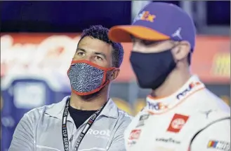  ?? Jared C. Tilton / Getty Images ?? Bubba Wallace, left, will drive for 23XI racing, a joint venture of Denny Hamlin, right, and Michael Jordan. He said he’s trying to make sure he doesn’t press on Sunday.