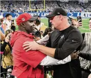  ?? Jose Juarez/Associated Press ?? Tampa Bay Buccaneers head coach Todd Bowles, left, talks with Detroit Lions head coach Dan Campbell following an NFC divisional playoff game Sunday in Detroit. The Lions won 31-23.