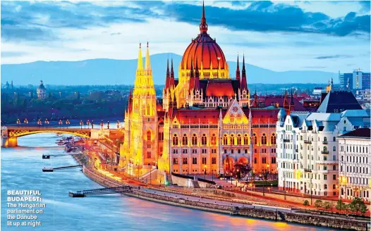  ??  ?? BEAUTIFUL BUDAPEST: The Hungarian parliament on the Danube lit up at night