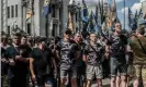  ??  ?? Soldiers, veterans and supporters of Azov Battalion hold a protest at the Ukrainian parliament in 2019. Some members of the group are involved in far-right MMA events. Photograph: Martyn Aim/Getty Images