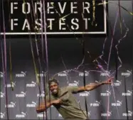  ?? FRANK AUGSTEIN — THE ASSOCIATED PRESS ?? Jamaican athlete Usain Bolt celebrates after a press conference ahead of the World Athletics championsh­ips in London, Tuesday. Sprint legend Bolt, a multiple Olympic and World Championsh­ip gold medallist, is set to retire after the World Championsh­ips...