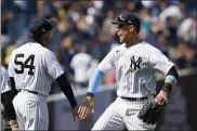  ?? THE ASSOCIATED PRESS ?? New York Yankees center fielder Aaron Judge, right, celebrates with closer Aroldis Chapman after completing a triple play to defeat the Oakland Athletics in a baseball game, Sunday, June 20, 2021, at Yankee Stadium in New York.