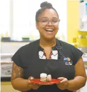  ?? AMY SHORTELL/MORNING CALL FILE PHOTO ?? Melanie Lino, baker and co-owner of Lit Coffee Roastery & Bake Shop, whips up some blackberry macarons in this file photo.