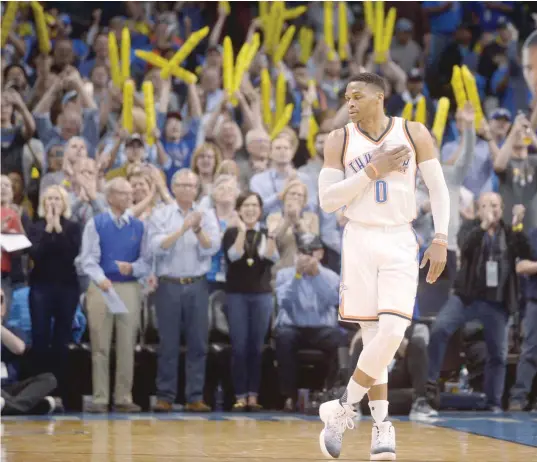  ?? — USA Today Sports ?? Oklahoma City Thunder guard Russell Westbrook (0) reacts as it announced that he has tied the season triple double record in action against the Milwaukee Bucks at Chesapeake Energy Arena.