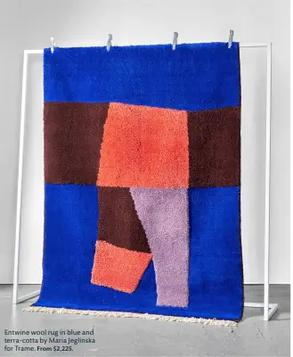  ??  ?? Entwine wool rug in blue and terra-cotta by Maria Jeglinska for Trame. From $2,225.