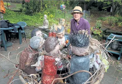  ?? JULIA MALAKIE PHOTOS / LOWELL SUN ?? Lowell artist Barbara Fletcher poses with her sculpture, ‘Invasive Eaters,’ which is being stored at a friend’s house in Arlington. It was removed from an outdoor sculpture exhibit in Concord for being ‘too political.’