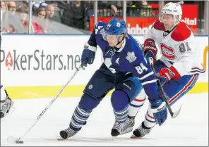 ?? Abelimage s, Gety image s ?? Toronto Maple Leafs’ Mikhail Grabovski gets past Montreal Canadiens’Lars Eller during January NHL action in Toronto.