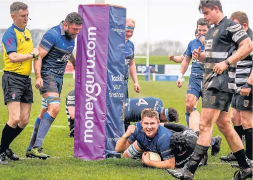  ??  ?? Dave Marwick celebrates after touching down for a try