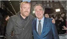  ??  ?? Actor Rhys Ifans and director Oliver Stone, right, pose for photograph­ers upon arrival at the premiere of the film ‘Snowden’.