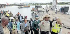  ??  ?? Zambian President Edgar Lungu leads his Botswana counterpar­t, Ian Khama (centre, hat in hands), during their tour of the Kazungula bridge constructi­on site this week.