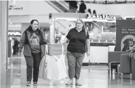  ?? Robin Jerstad/ Contributo­r ?? Susan Lindsey and great-aunt CJ Lindsey shop at North Star Mall. The National Retail Federation estimated that a record 166.3 million people will shop from Thanksgivi­ng Day through Cyber Monday.