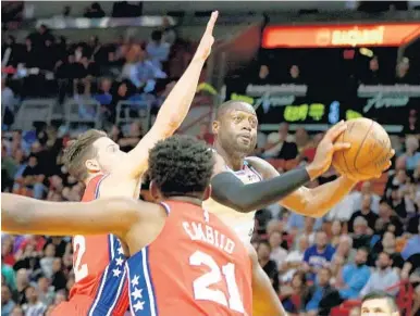  ?? PEDRO PORTAL/EL NUEVO HERALD ?? Dwyane Wade scored 16 points in the Heat’s home win over the Sixers on March 8.