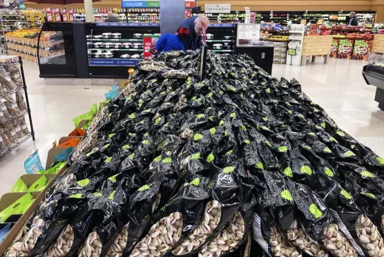 ?? Nam Y. Huh, The Associated Press ?? Bags of pistachios are displayed at a grocery store in Mount Prospect, Ill., on Friday. Food costs, along with energy prices, are a big contributo­r to the nation’s rising inflation rate.