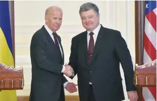  ??  ?? KIEV: US Vice President Joe Biden (Left) and Ukrainian President Petro Poroshenko shake hands at the end of their joint press statement following their meeting in Kiev yesterday. —AFP