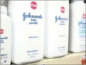 ?? PHOTO: REUTERS ?? Bottles of Johnson & Johnson Baby Powder line a shelf. The talcbased product is alleged to cause ovarian cancer.
