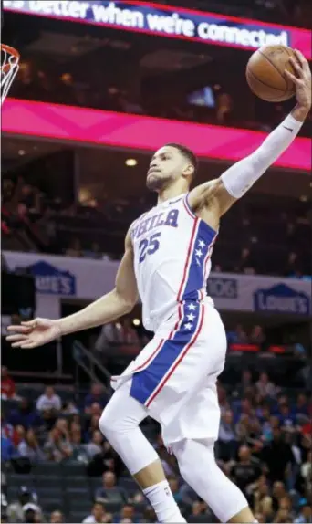  ?? NELL REDMOND — THE ASSOCIATED PRESS ?? 76ers guard Ben Simmons dunks against the Charlotte Hornets in the second half of an NBA basketball game in Charlotte, N.C., on Sunday. Philadelph­ia won 119-102. The Associated Press