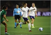  ?? RONALD MARTINEZ — GETTY IMAGES ?? Alex Morgan, center, and the USWNT will look to bounce back from a rare loss to Mexico today against Colombia.