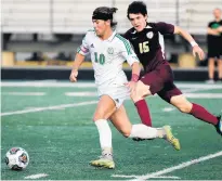  ?? ?? Valparaiso’s EJ Dreher pushes the ball upfield as Chesterton’s Liam Grimes pursues.