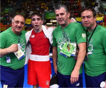  ??  ?? Eddie Bolger (right) with fellow coaches Zaur Antia (left), and John Conlan, and boxer Michael Conlan, after Conlan’s defeat of Aram Avagyan of Armenia in their Bantamweig­ht preliminar­y round of 16 bout in the Riocentro Pavillion 6 Arena, Barra da...