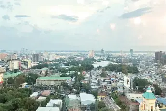  ??  ?? Cebu City skyline viewed from the Ambassador Lounge