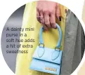  ??  ?? A dainty mini purse in a soft hue adds a hit of extra sweetness