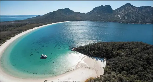  ?? ?? you can walk to Wineglass Bay from Freycinet National Park, but if you’re not keen to do all that ‘exercise’, then join a cruise.