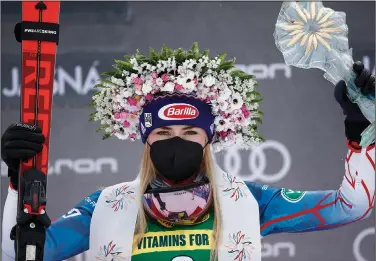  ?? Associated Press ?? Big winner: United States' Mikaela Shiffrin celebrates on the podium after winning an alpine ski, World Cup women's slalom in Jasna, Slovakia, Saturday.