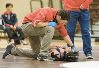  ?? JANE THERESE/SPECIAL TO THE MORNING CALL PHOTOS ?? Saucon Valley’s Travis Riefenstah­l re-injured his shoulder during the PIAA Class 2A preliminar­y round but came back to wrestle in all the Panthers’ matches in Hershey.