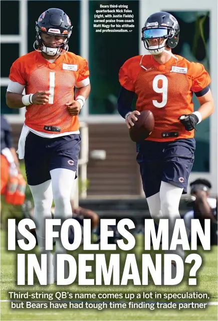  ?? AP ?? Bears third-string quarterbac­k Nick Foles (right, with Justin Fields) earned praise from coach Matt Nagy for his attitude and profession­alism.