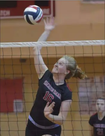  ?? PETE BANNAN – DIGITAL FIRST MEDIA ?? Sacred Heart’s Jaycee Webster smashes one of her 19 kills in a 3-0 win over Villa Joseph Marie Monday. Webster became the program leader with 834 career kills.