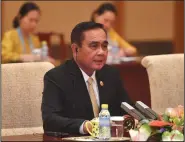  ?? PARKER SONG/POOL/GETTY IMAGES ?? Thailand’s Prime Minister Prayuth Chan-ocha speaks with Chinese Premier Li Keqiang, not pictured, during their meeting at the Diaoyutai State Guesthouse on April 26 in Beijing.