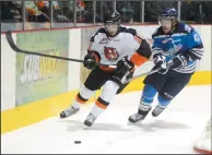  ?? NEWS PHOTO EMMA BENNETT ?? Medicine Hat Tigers’ Gavin Broadhead, left, battles during a March 26, 2013 playoff game at The Arena. Broadhead is going to try out speedskati­ng after a successful couple of tryouts in the RBC Training Ground series.