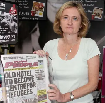  ??  ?? Val Boggan, chair of the Rosslare Developmen­t Community Associatio­n, at Boggan’s supermarke­t in Rosslare with a copy of last week’s Wexford People.