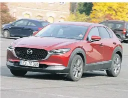  ?? FOTO: MAZDA ?? Den populären Crossover CX-30 hat Mazda in diesem Jahr optisch wie technisch aufgefrisc­ht.