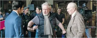  ?? GILES KEYTE/SONY PICTURES ?? Mark Wahlberg, left, Ridley Scott and Christophe­r Plummer plan a scene on the set of All the Money in the World. The reshoot with Plummer took nine days to film.