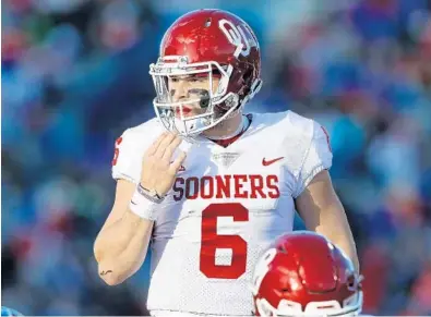  ?? JAMIE SQUIRE/GETTY IMAGES ?? It’s perhaps the worst kept secret in the NFL that the Miami Dolphins covet quarterbac­k Baker Mayfield, above, but they might have to move up from their No. 11 spot in order to have a shot at him.