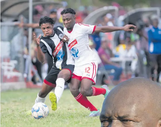  ??  ?? FILE Ronaldo Webster of Cavalier (left) is tackled by UWI FC’s Nacquain Brown during a Red Stripe Premier League match at the Mona Bowl on Sunday, February 23, 2020.