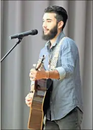  ??  ?? RIGHT: Isaac Streetman plays favorites like Elvis Presley’s “Jailhouse Rock” and the hymn “Amazing Grace” for students at Youngs Grove Elementary.