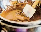  ?? ?? Place a bowl over a saucepan containing 1 inch of water, ensuring the bowl doesn’t float or touch the water. Bring water to a simmer. Add the chocolate; wait 45 seconds before stirring.