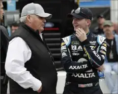  ?? Associated Press ?? Car owner Rick Hendrick, left, talks with William Byron on pit road during qualifying for the Daytona 500 Sunday.