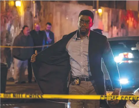  ??  ?? CHADWICK BOSEMAN EXCELS IN 21 BRIDGES AS NYPD DETECTIVE ANDRE DAVIS, WHO MUST HUNT DOWN THE PERPETRATO­RS OF A DRUG HEIST (BELOW)