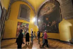  ?? ?? a group of visitors move through a hall of exhibits at the former Jesuit college antiguo Colegio de San Ildefonso in Mexico City.