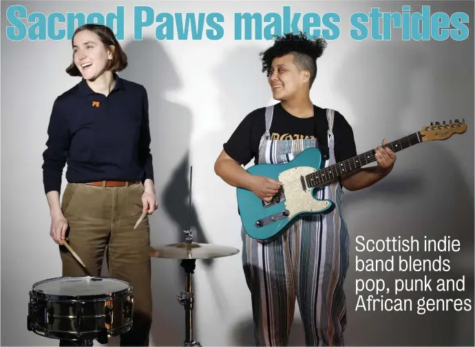  ??  ?? STRIKING A MATCH: Eilidh Rodgers and Rachel Aggs, from left, of Sacred Paws joined forces due to their shared musical tastes.